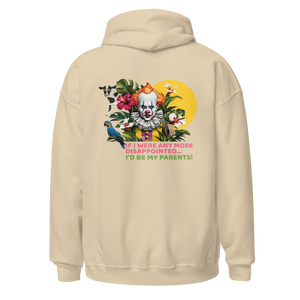 Sand color unisex hoodie, back view, bold graphic design with clown face, tropical flowers, parrots, and text "If I were any more disappointed, I’d be my parents!" design by pepa de mango