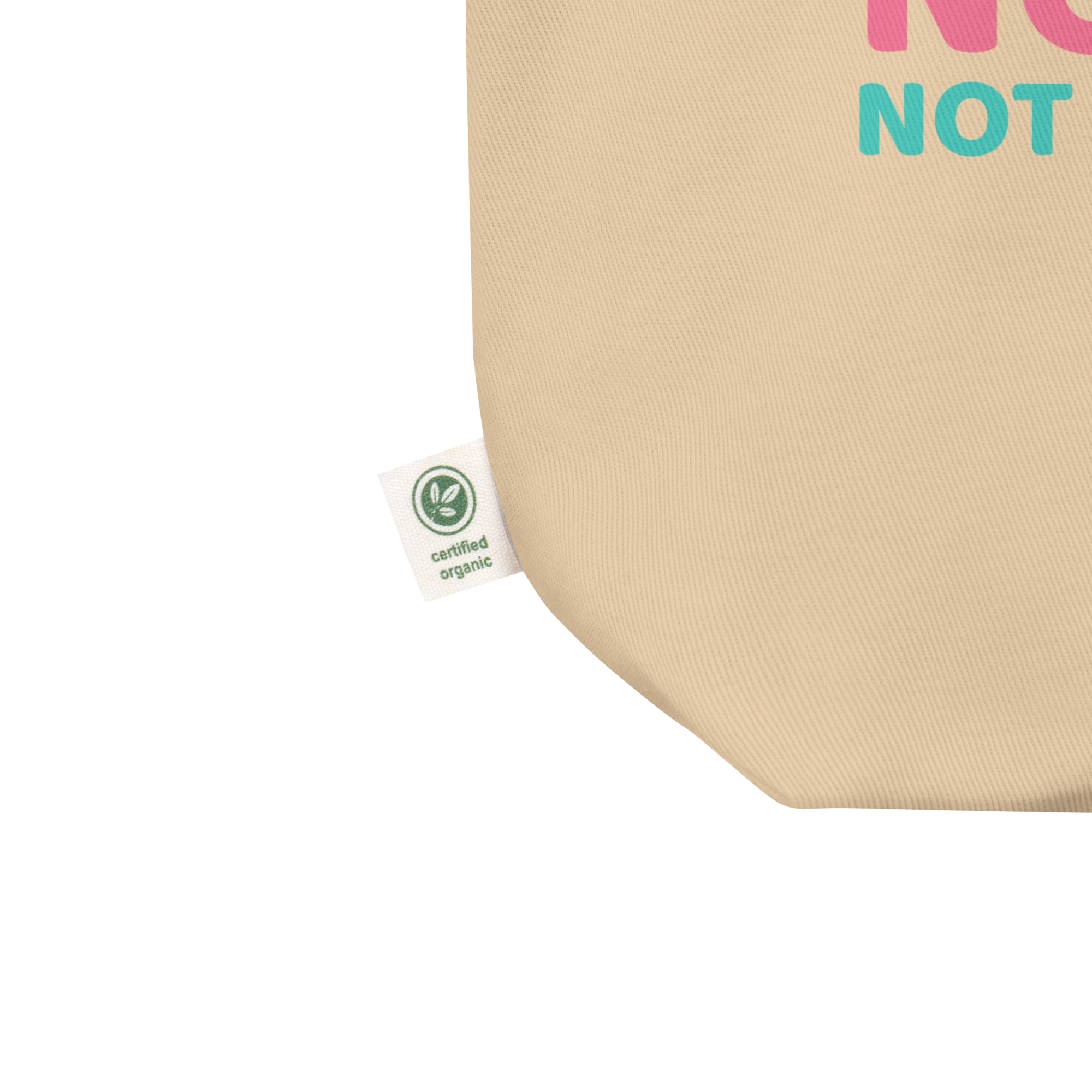 Close-up view of certified organic label on beige eco tote bag by Pepa de Mango, sustainability-focused cotton fabric with green certification tag, ethical fashion detail